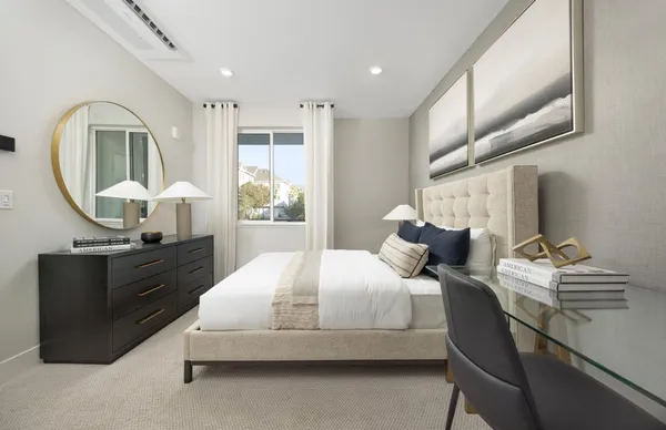 a bedroom with a bed and window