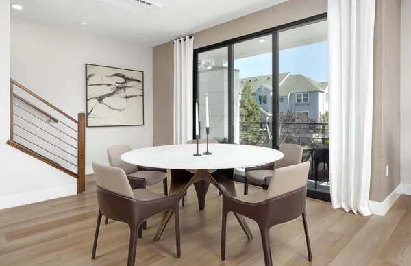 a view of a table and chairs in the room