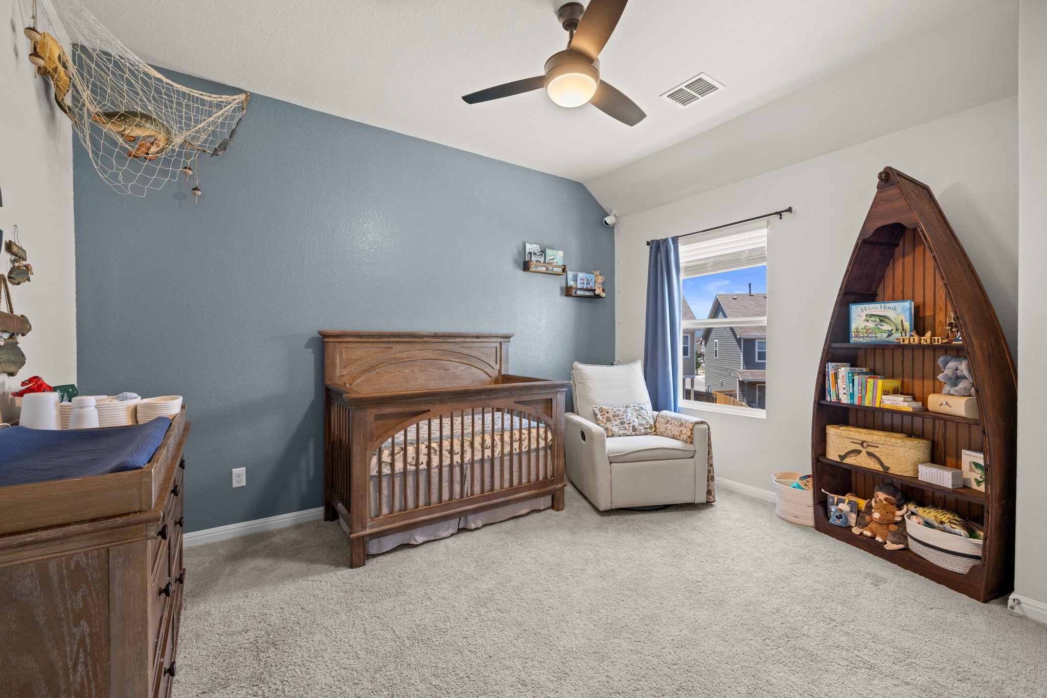 2049 Winston Way Leander, TX 78641 - Photo 17 of 35 Large secondary bedroom #2 with vaulted ceiling, ceiling fan and walk-in closet.