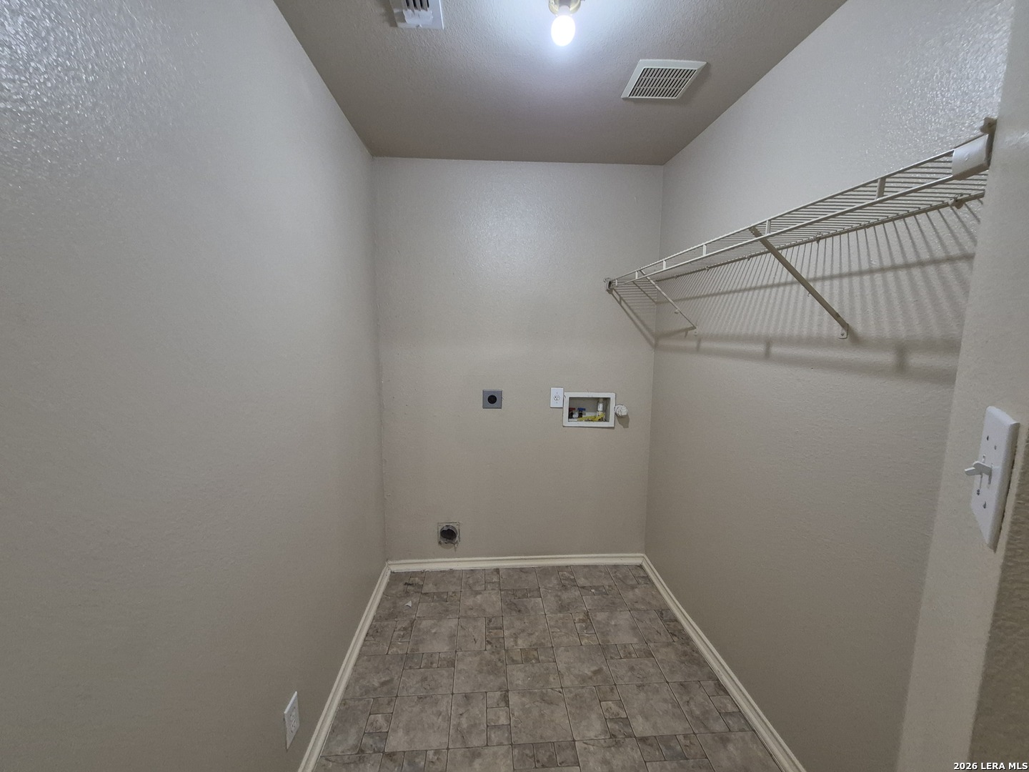 3338 Whisper Manor Schertz, TX 78108 - Photo 17 of 40 a view of a room with racks on the wall