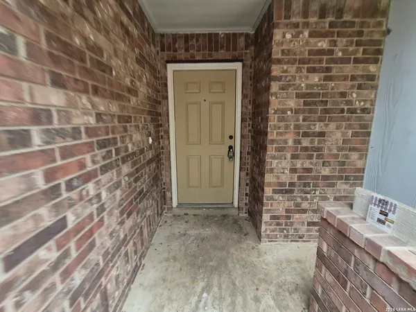 a bathroom with a shower and a sink