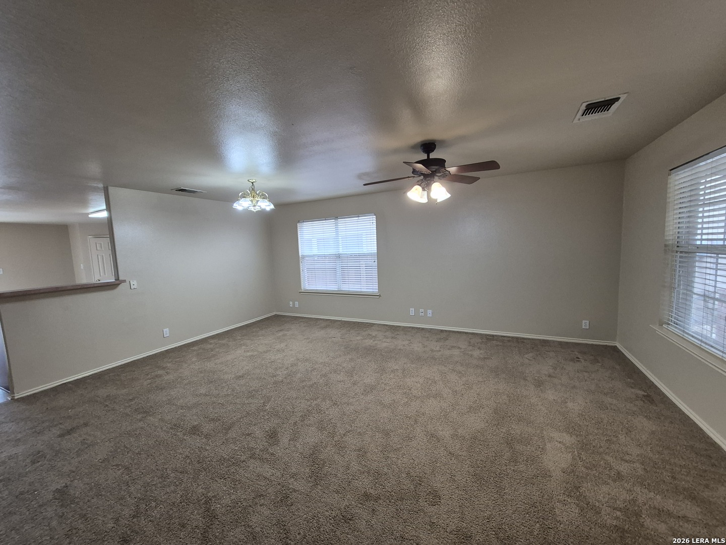 3338 Whisper Manor Schertz, TX 78108 - Photo 3 of 40 a view of an empty room with a chandelier fan