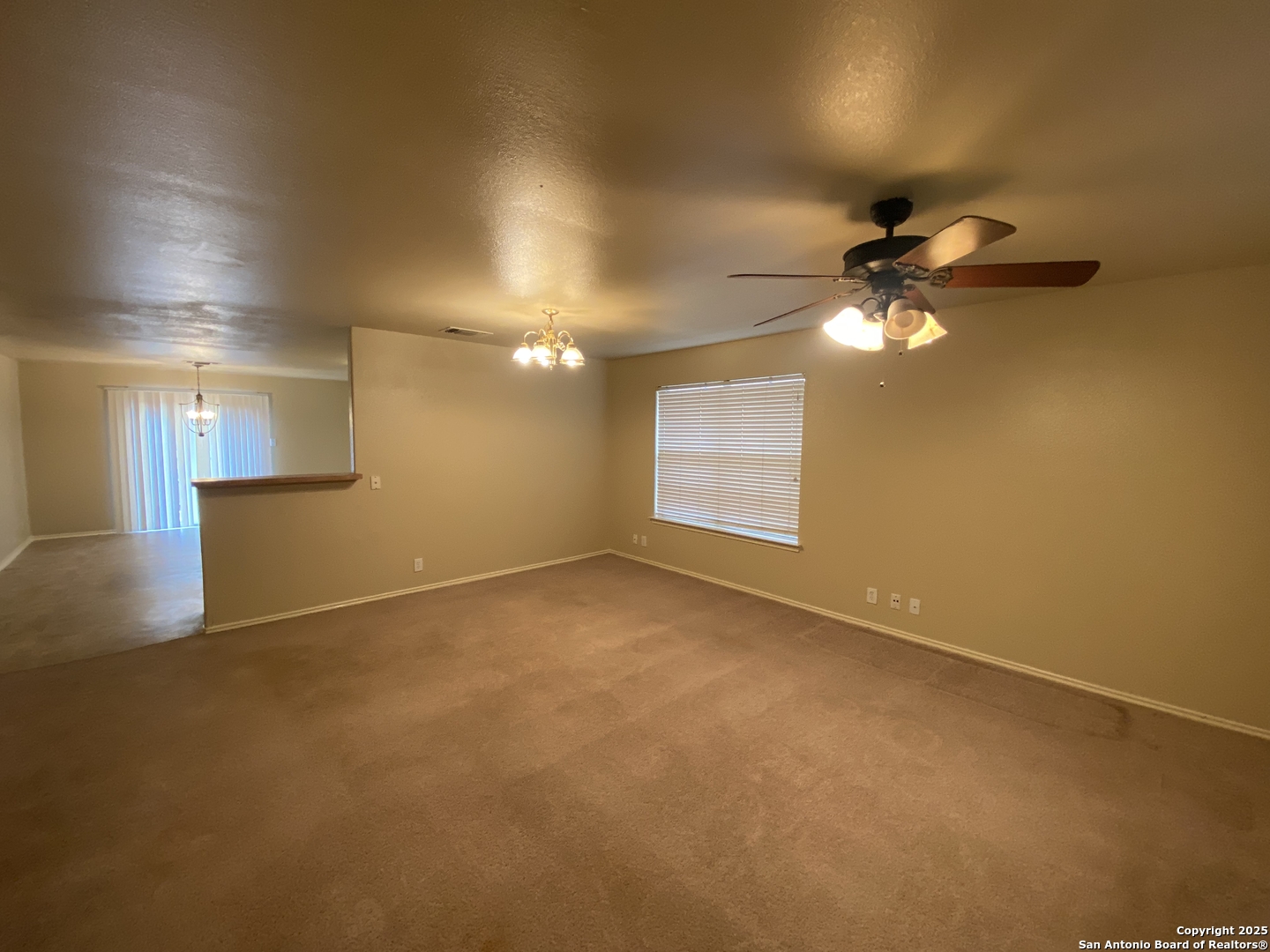 3338 Whisper Manor Schertz, TX 78108 - Photo 3 of 45 an empty room with a empty space and a ceiling fan