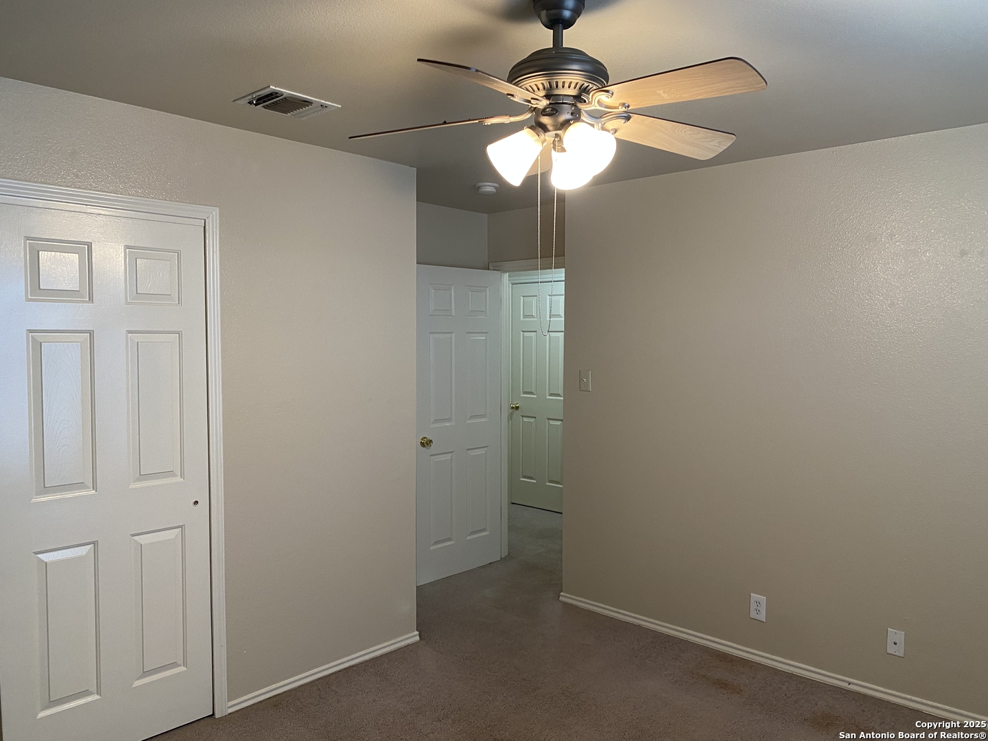 3338 Whisper Manor Schertz, TX 78108 - Photo 31 of 45 an empty room with a chandelier fan