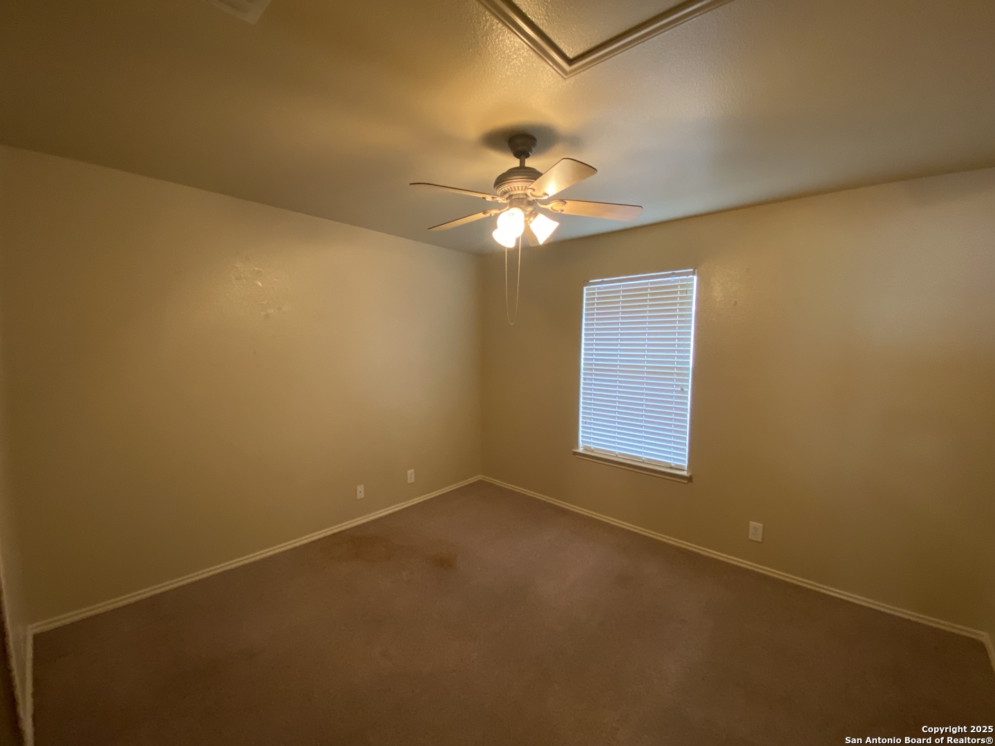 3338 Whisper Manor Schertz, TX 78108 - Photo 33 of 45 an empty room with a window and a fan