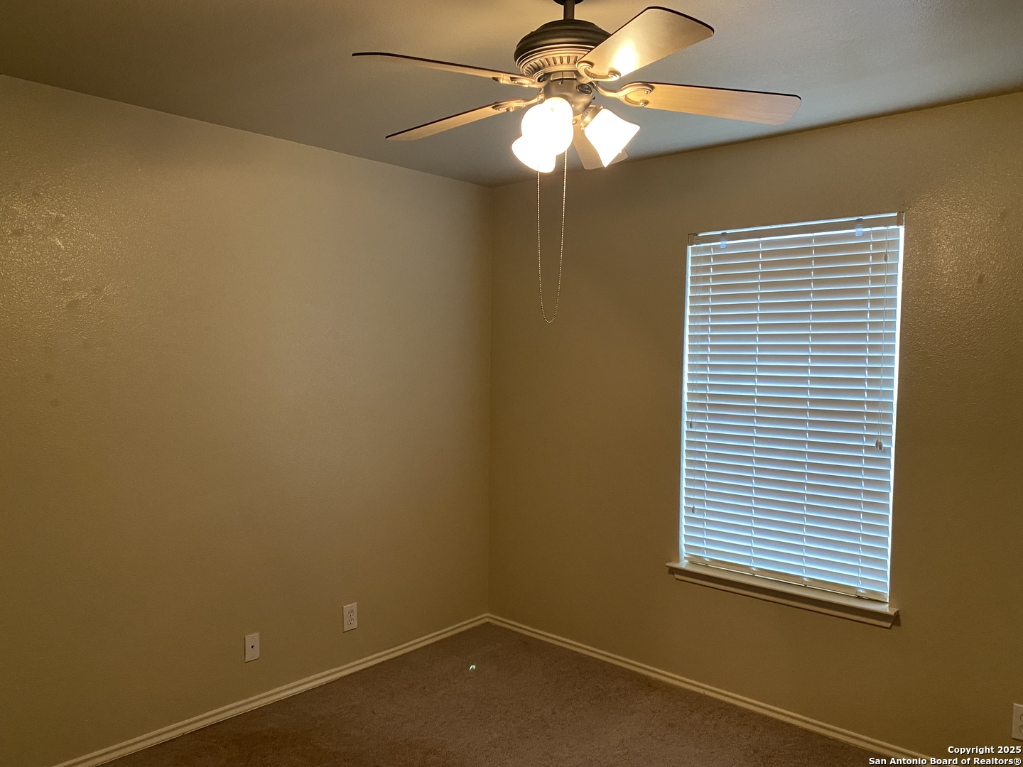 3338 Whisper Manor Schertz, TX 78108 - Photo 34 of 45 an empty room with a window and a fan