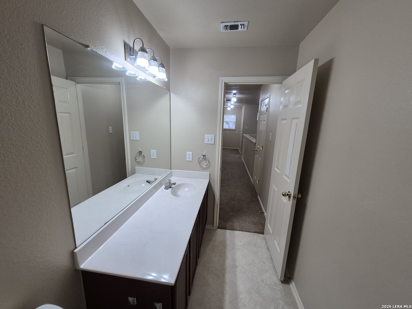 3338 Whisper Manor Schertz, TX 78108 - Photo 40 of 40 a bathroom with a sink a mirror and a shower