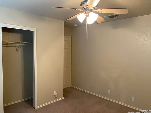 a view of a small space with a fan