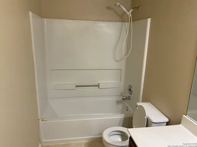 a bathroom with a sink a mirror and a shower