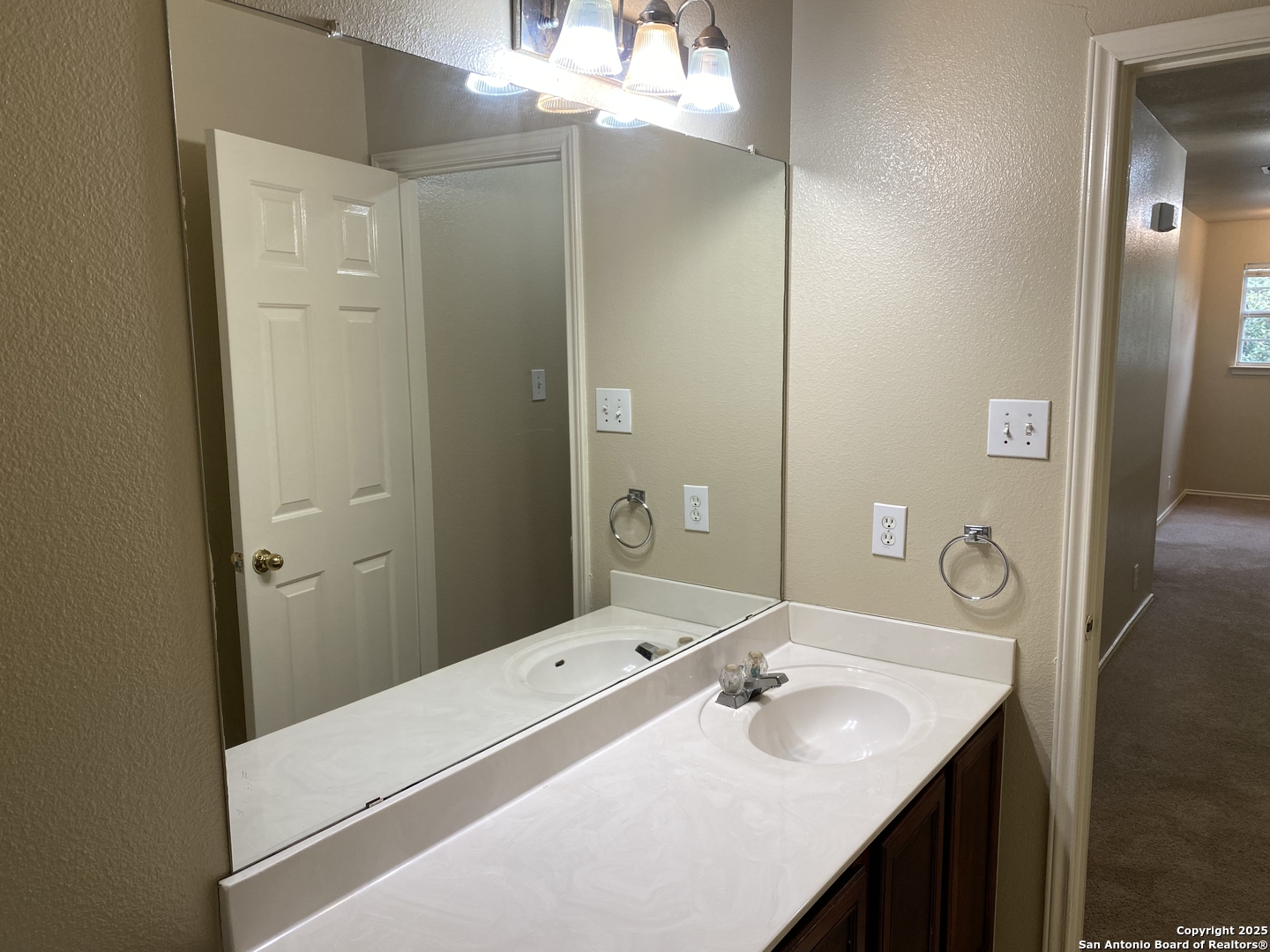 3338 Whisper Manor Schertz, TX 78108 - Photo 45 of 45 a bathroom with a sink a mirror and a shower