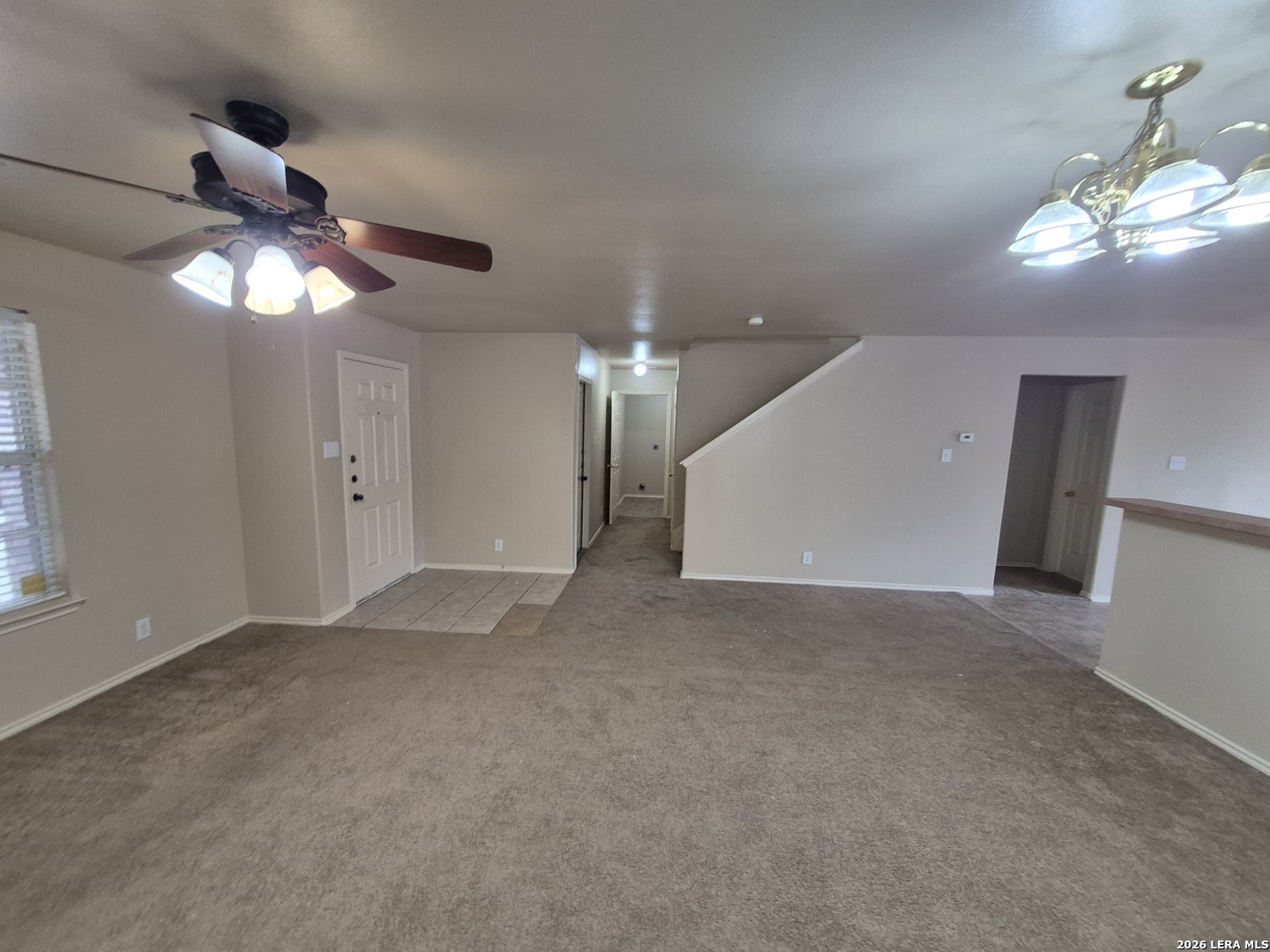 3338 Whisper Manor Schertz, TX 78108 - Photo 6 of 40 a view of an empty room with a chandelier fan