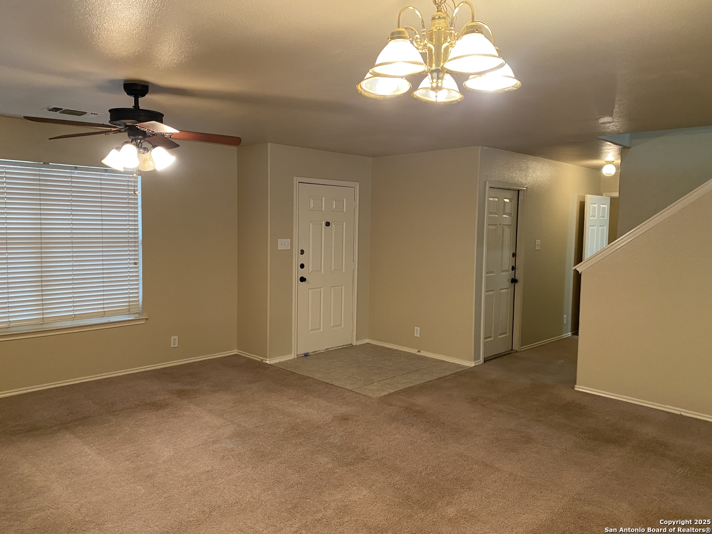 3338 Whisper Manor Schertz, TX 78108 - Photo 6 of 45 a view of an empty room with a chandelier fan