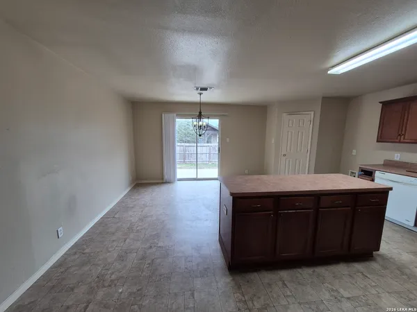 a room with a table and chairs