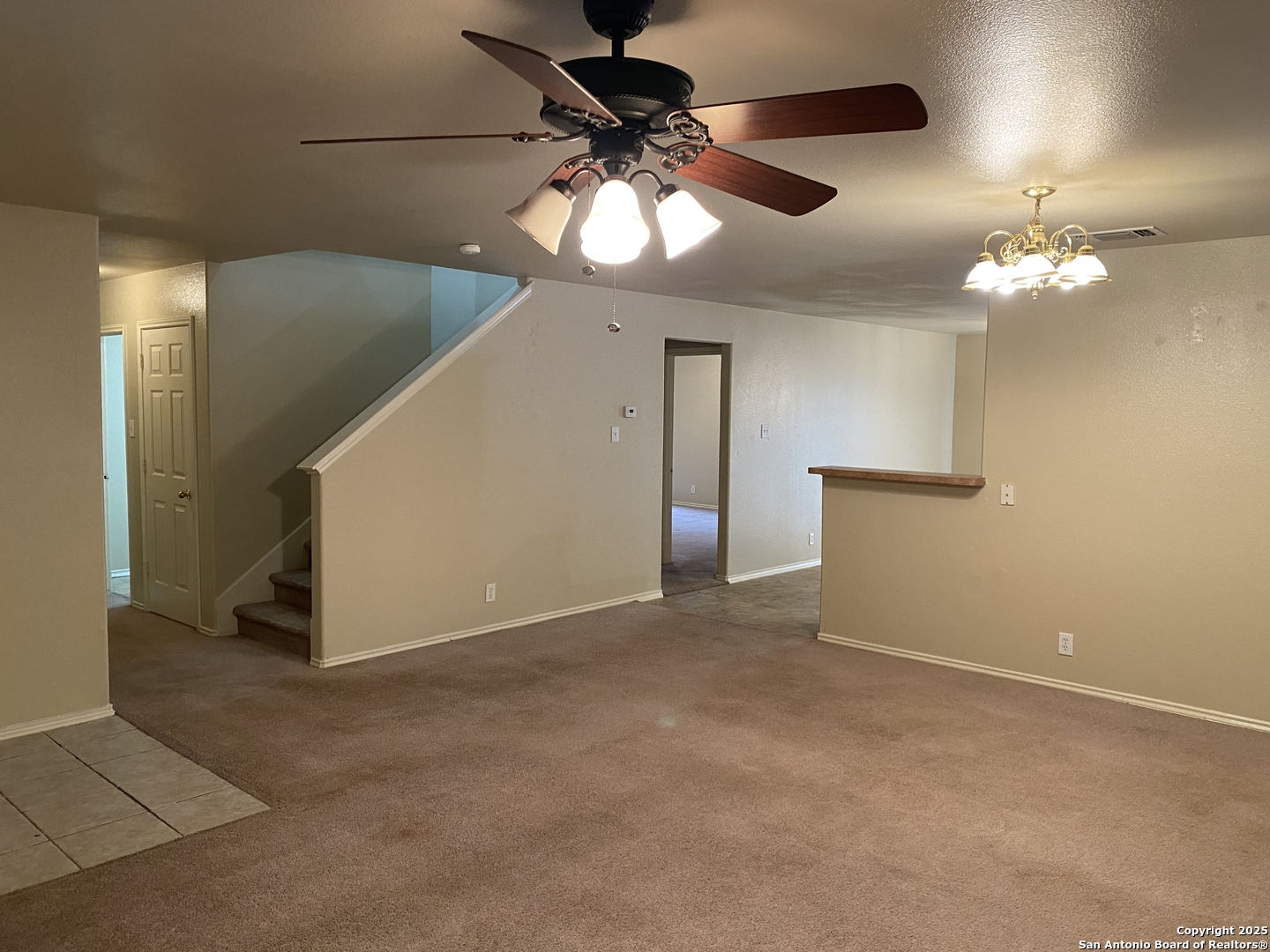 3338 Whisper Manor Schertz, TX 78108 - Photo 7 of 45 a view of an empty room with a chandelier fan