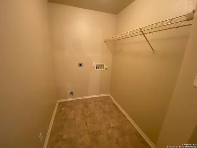 a bathroom with a toilet mirror and vanity