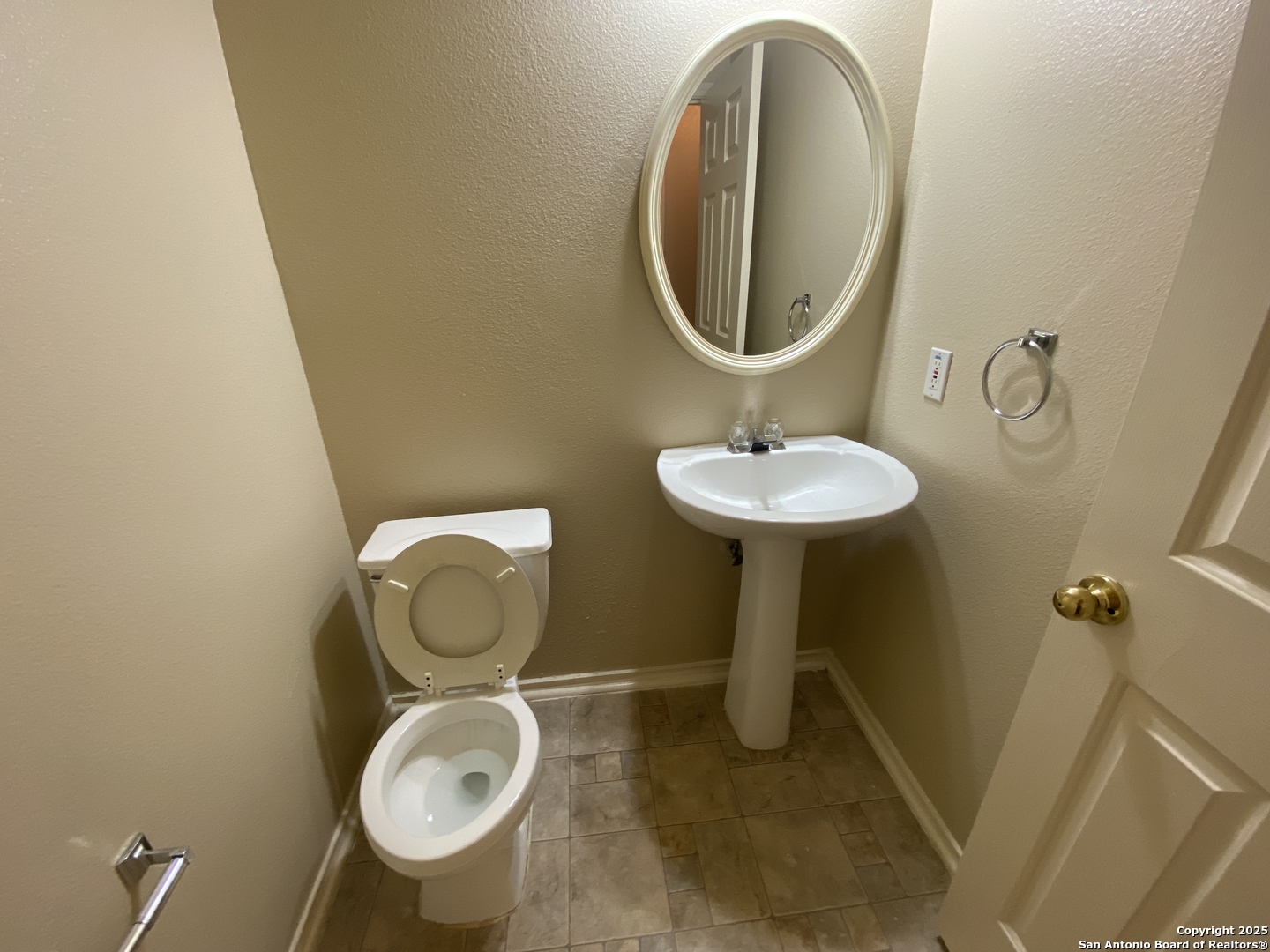 3338 Whisper Manor Schertz, TX 78108 - Photo 9 of 45 a bathroom with a toilet mirror and vanity