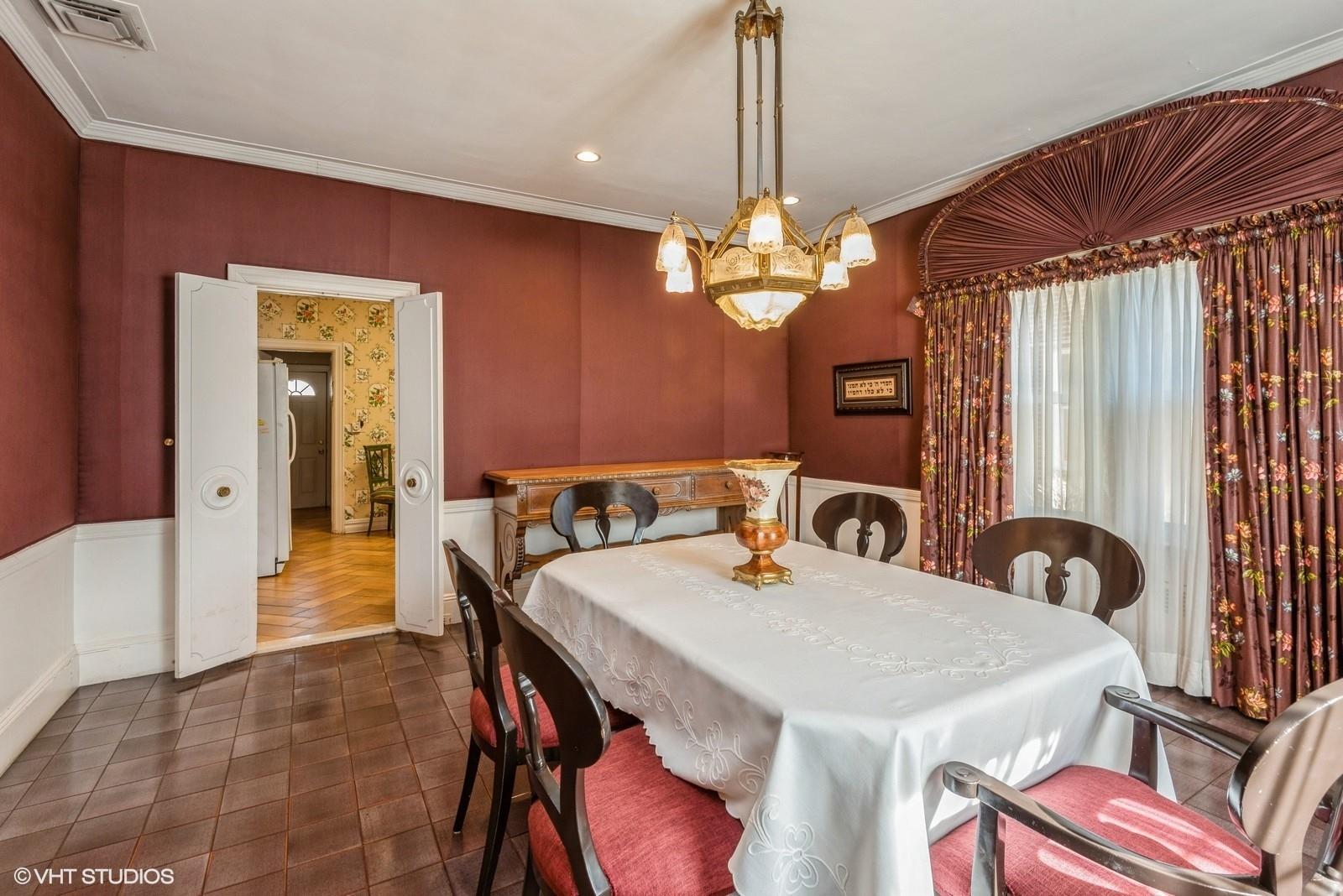 130 Hards Lane Lawrence, NY 11559 - Photo 13 of 36 a view of a dining room with furniture and chandelier