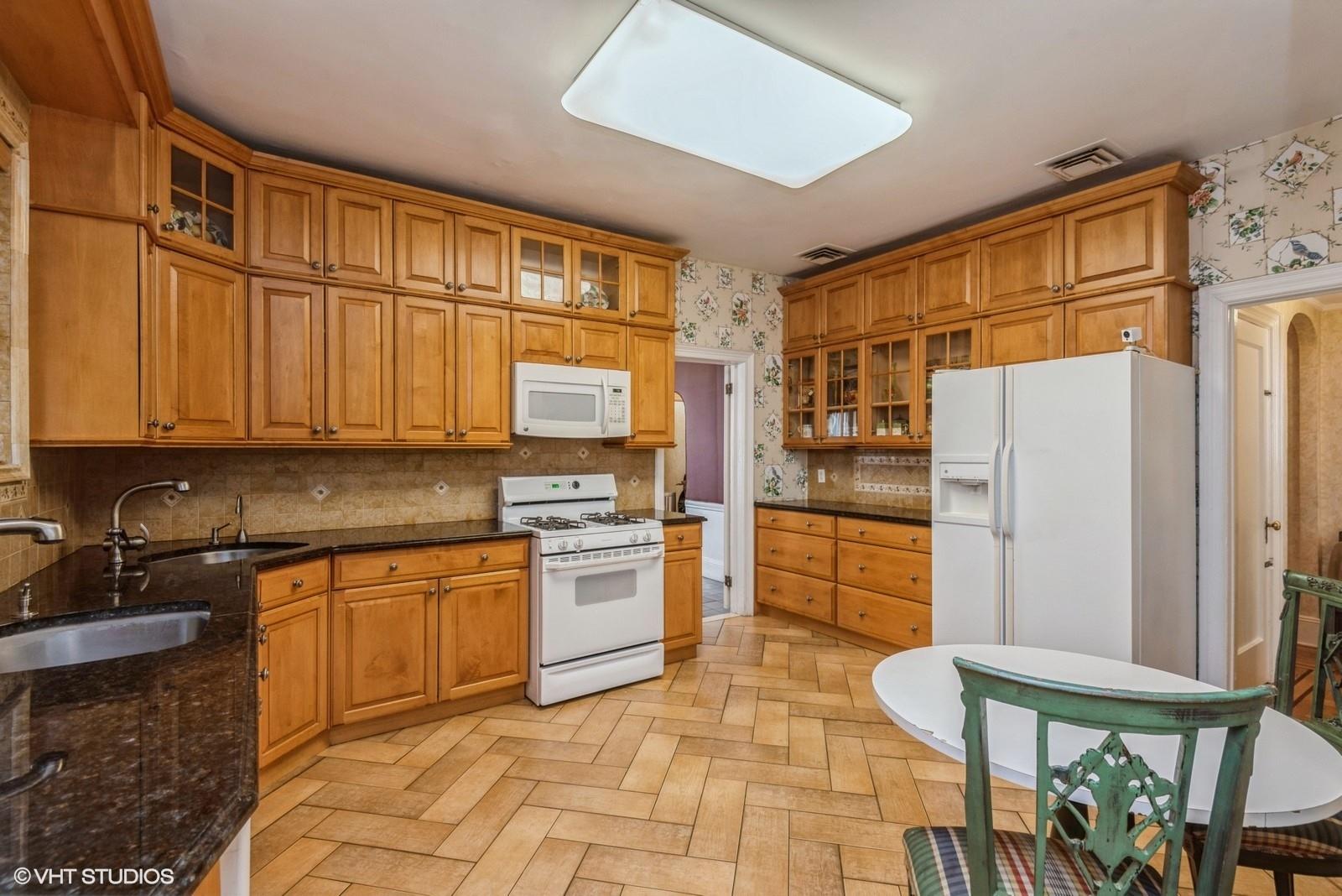 130 Hards Lane Lawrence, NY 11559 - Photo 20 of 36 a kitchen with stainless steel appliances granite countertop a refrigerator sink and stove