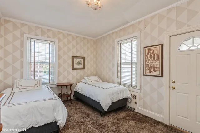 a view of a porch with wooden fence