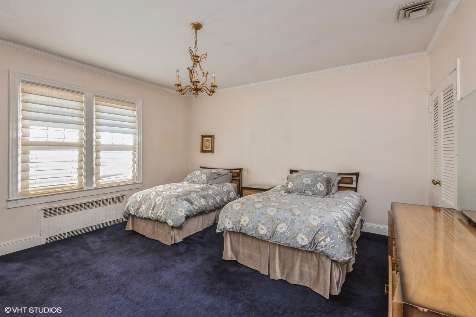 130 Hards Lane Lawrence, NY 11559 - Photo 26 of 36 a spacious bedroom with two beds and a window