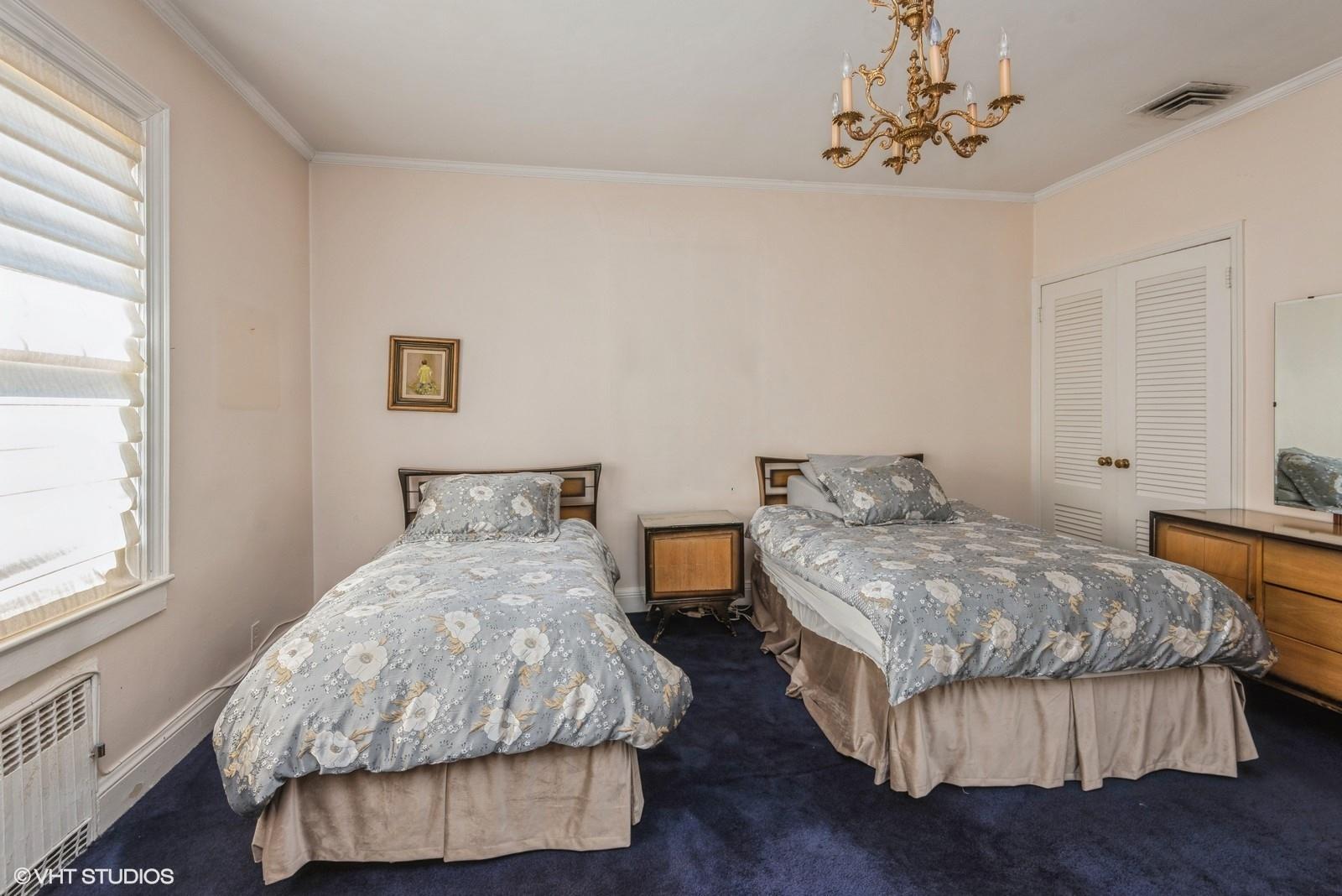 130 Hards Lane Lawrence, NY 11559 - Photo 30 of 36 a bedroom with two beds and a window