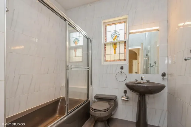 a bedroom with a bed and cabinets