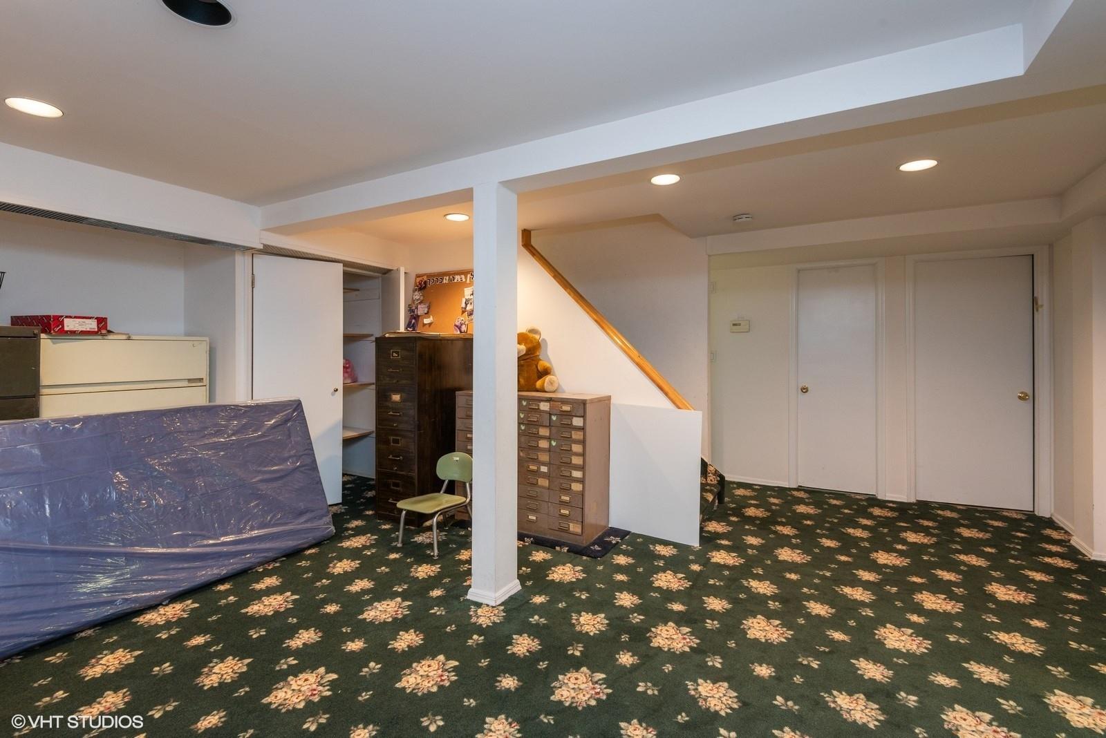 130 Hards Lane Lawrence, NY 11559 - Photo 36 of 36 a bedroom with a bed and cabinets