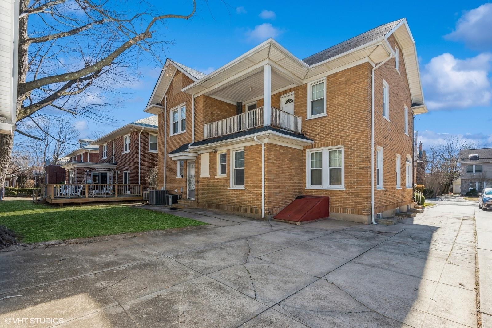 130 Hards Lane Lawrence, NY 11559 - Photo 5 of 36 a front view of a house with a yard