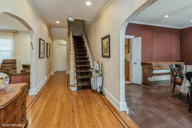a view of a living room with wooden floor
