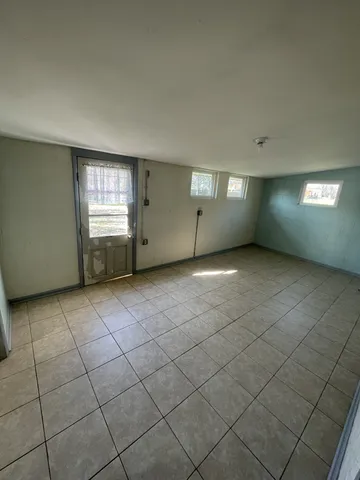 a view of an empty room with windows