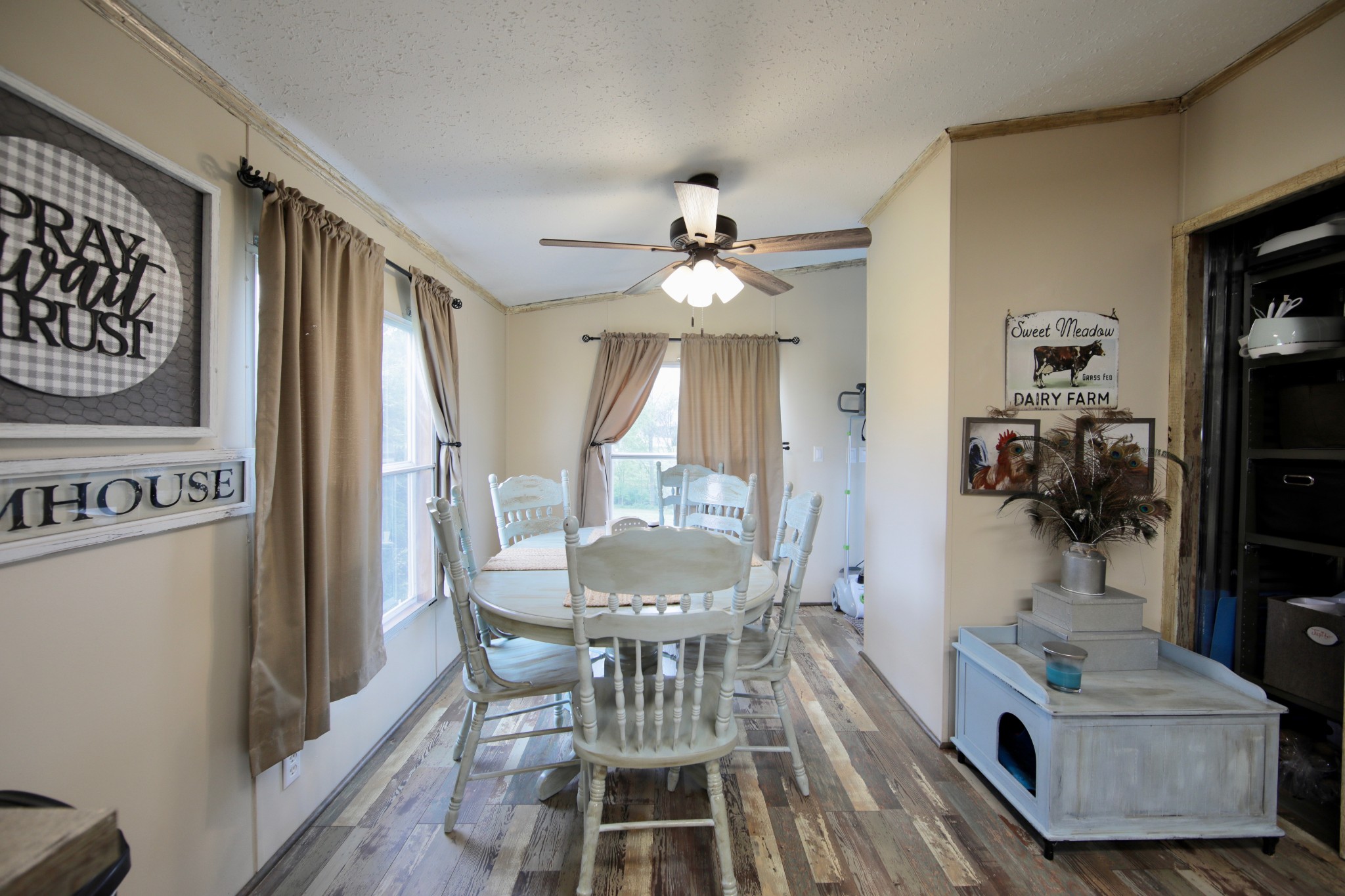 326 Ranch Road Portland, TN 37148 - Photo 6 of 30 a view of a dining room with furniture a chandelier and wooden floor