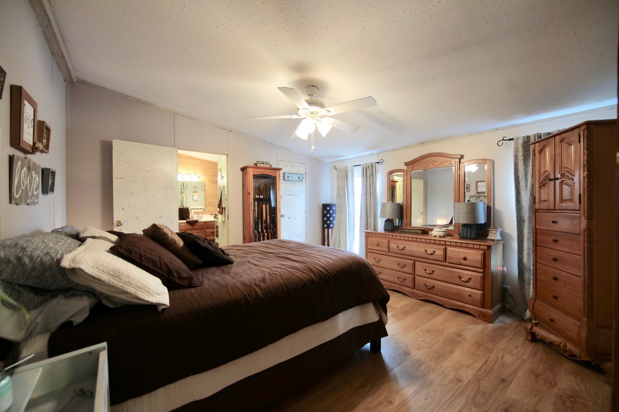 326 Ranch Road Portland, TN 37148 - Photo 7 of 30 a bedroom with a bed and dresser with mirror
