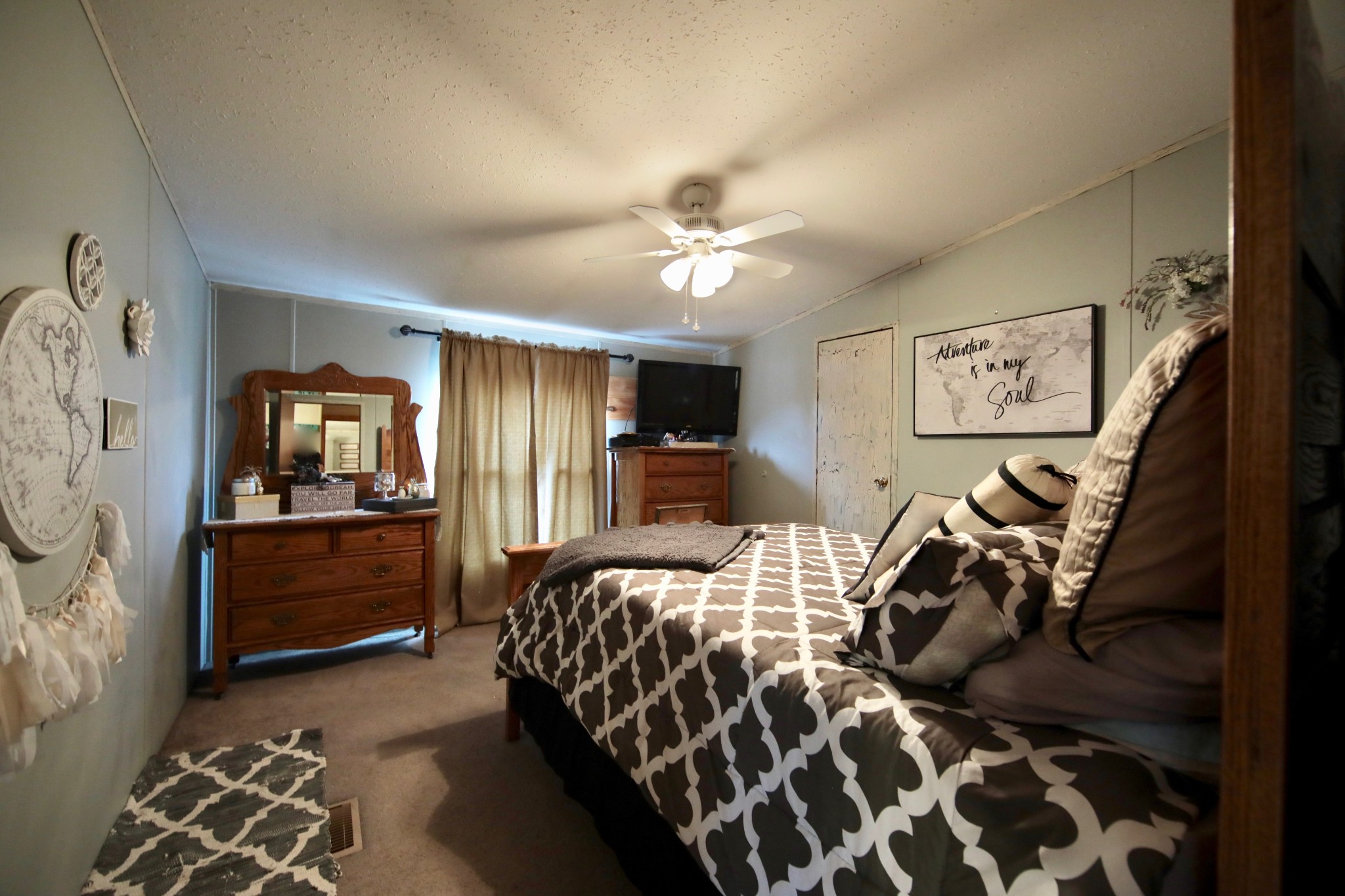 326 Ranch Road Portland, TN 37148 - Photo 8 of 30 a bedroom with a bed and a chandelier