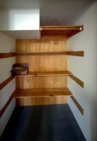 a kitchen with stainless steel appliances granite countertop a stove and a microwave