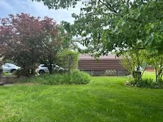 a view of outdoor space with deck and yard