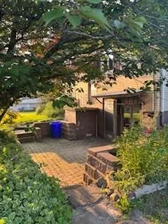 a view of a house with a backyard