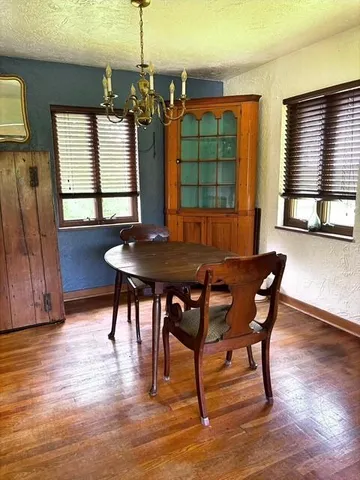 a view of a dining room with furniture and window