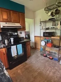 a kitchen with a stove and cabinets