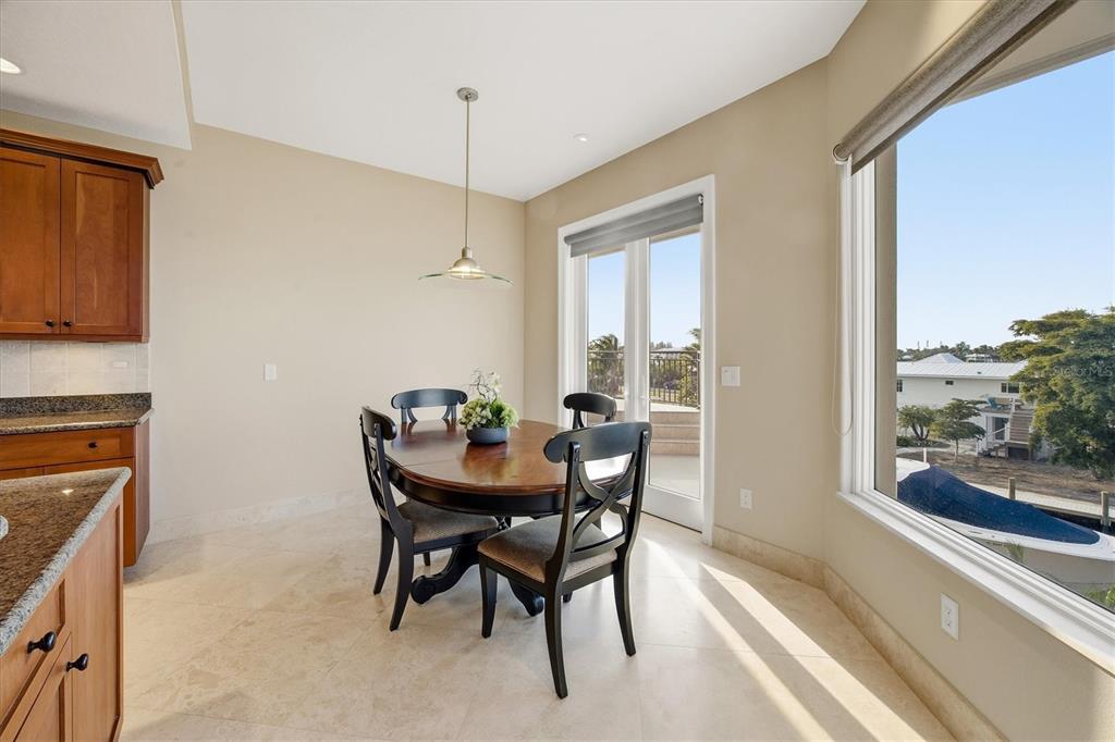 761 Norton Street Longboat Key, FL 34228 - Photo 37 of 66 a view of a dining room with furniture window and outside view