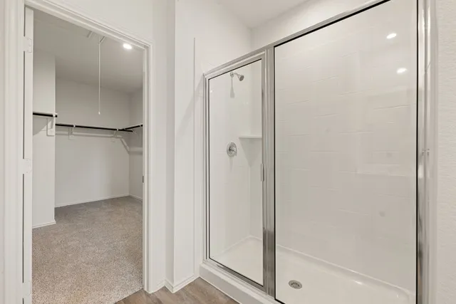 a view of bathroom with a glass shower door
