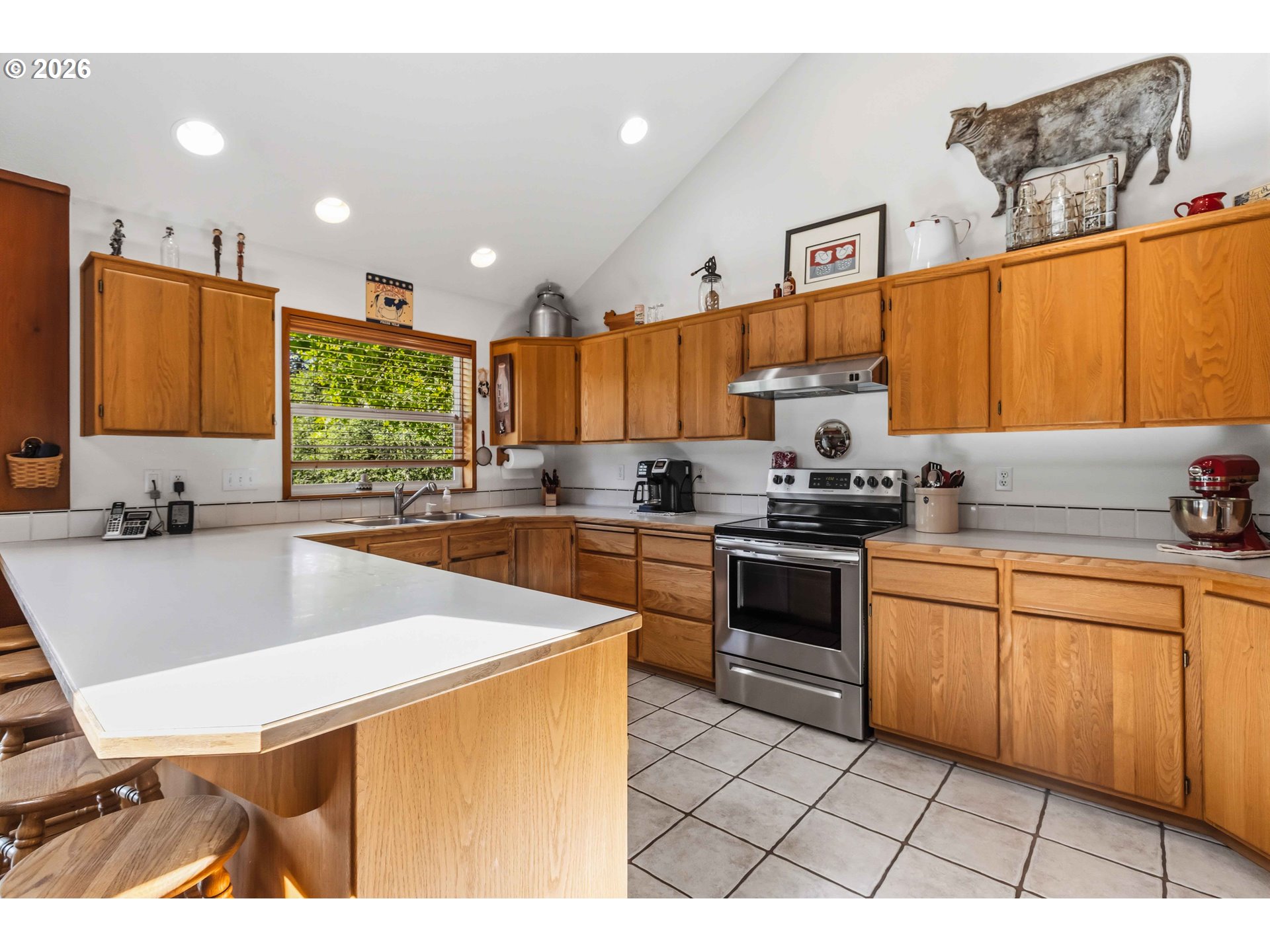 359 Frank Smith Road Toutle, WA 98649 - Photo 11 of 44 a kitchen with stainless steel appliances a stove a sink a microwave a center island and a refrigerator