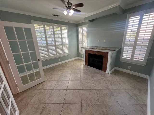 a bathroom with a granite countertop sink mirror vanity and toilet