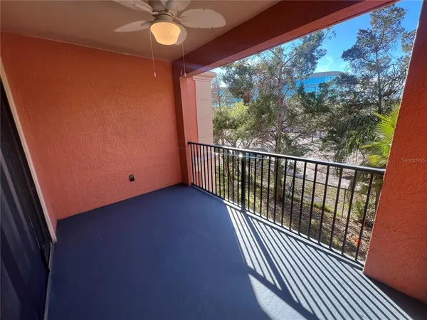 a front view of a house with a yard and potted plants