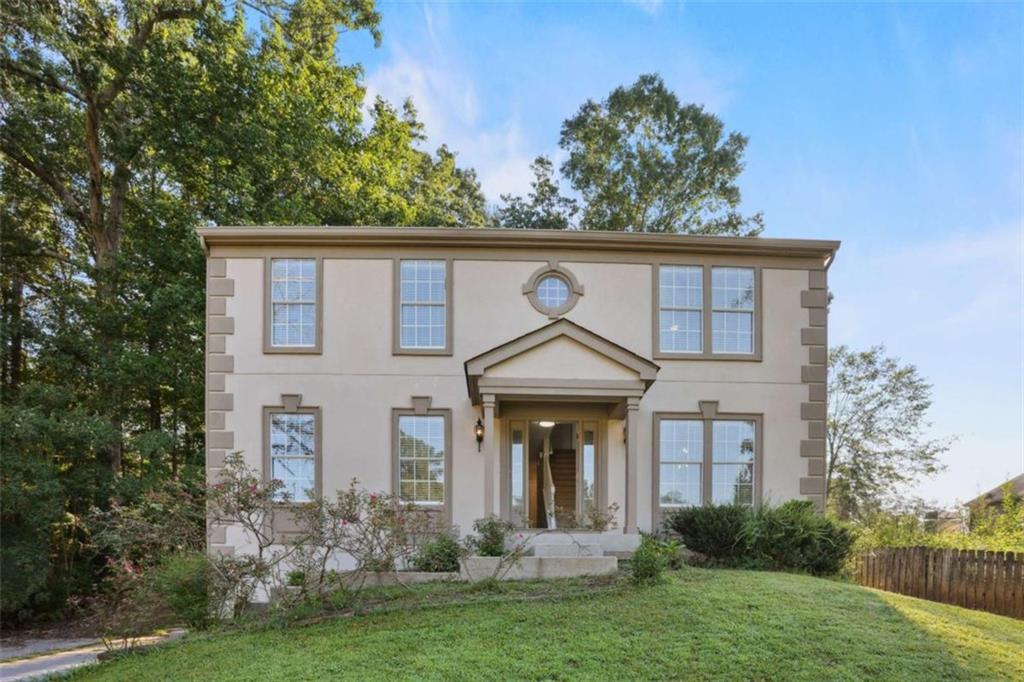 508 Sutters Mill Road Stone Mountain, GA 30087 - Photo 1 of 1 a front view of a house with a yard