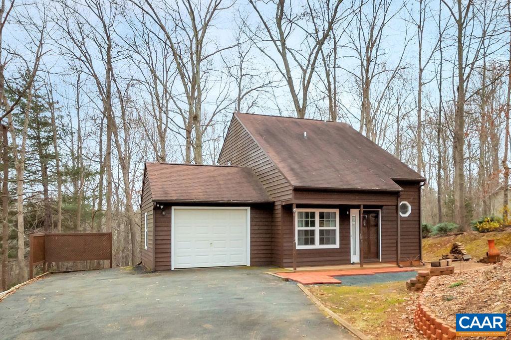 88 Rose Road Ruckersville, VA 22968 - Photo 1 of 34 a front view of a house with a yard and garage