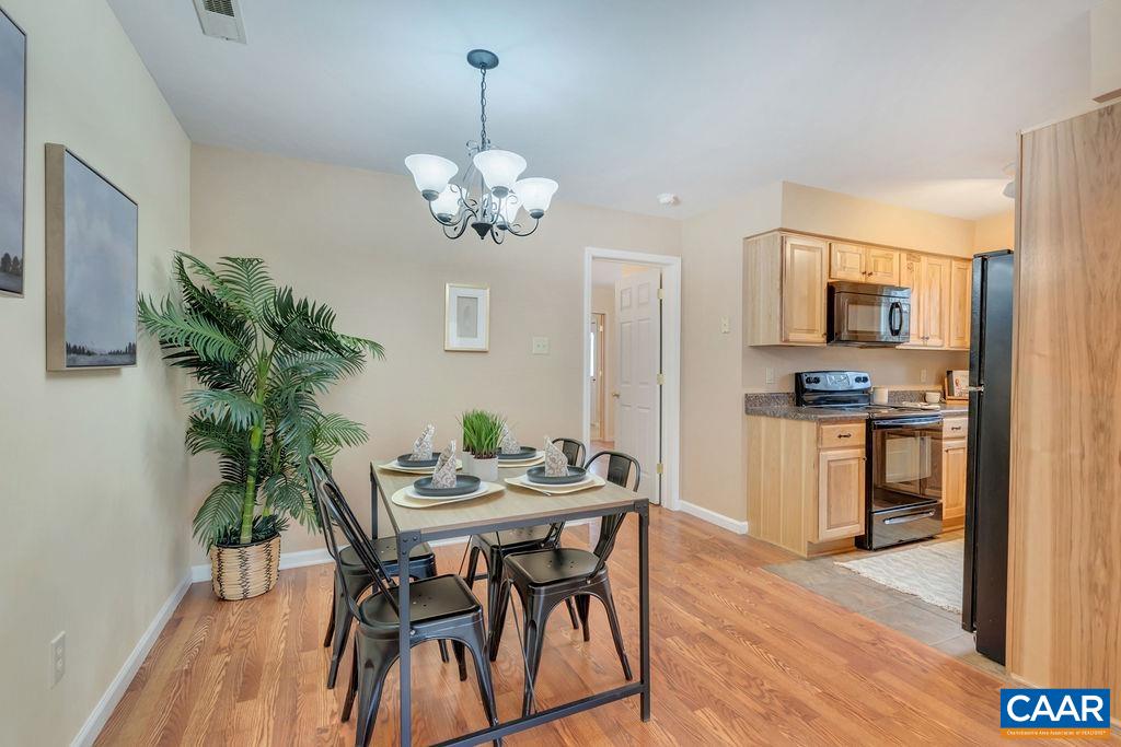 88 Rose Road Ruckersville, VA 22968 - Photo 13 of 34 a view of a dining room with furniture and wooden floor