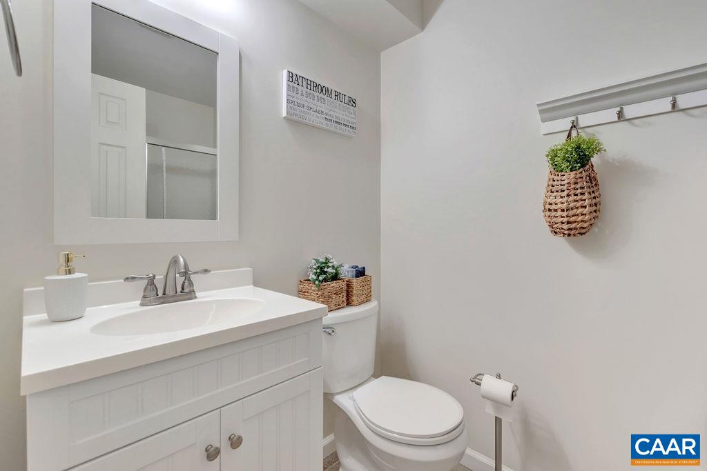 88 Rose Road Ruckersville, VA 22968 - Photo 23 of 34 a bathroom with a sink mirror vanity and toilet