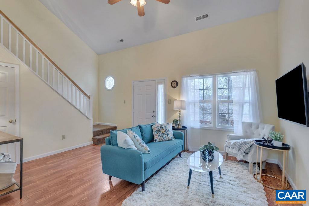 88 Rose Road Ruckersville, VA 22968 - Photo 9 of 34 a living room with furniture a flat screen tv and a large window