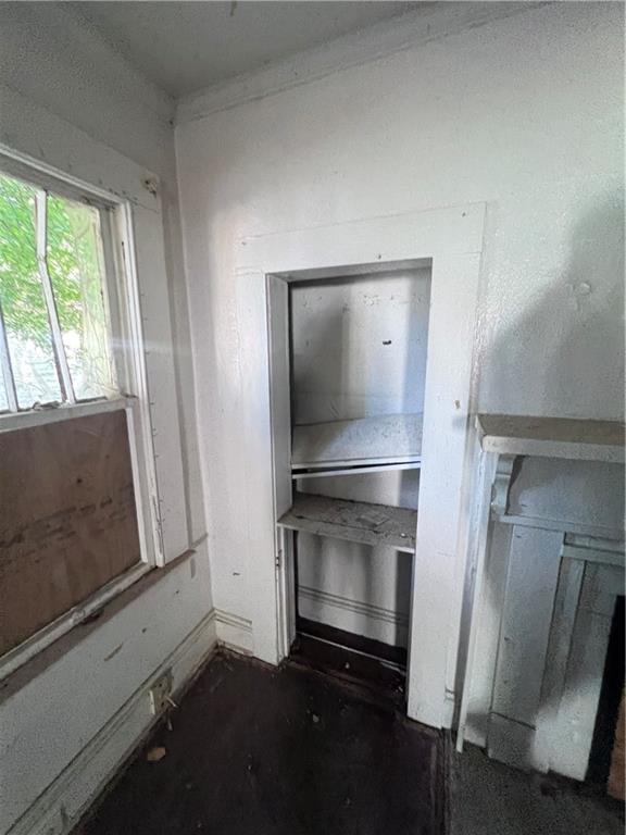 554 Nelson Street Macon, GA 31206 - Photo 18 of 37 a living room with a fireplace and a window