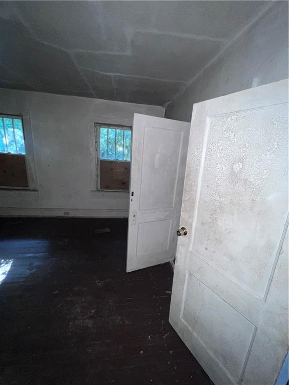 554 Nelson Street Macon, GA 31206 - Photo 32 of 37 view of room with window and hardwood floor